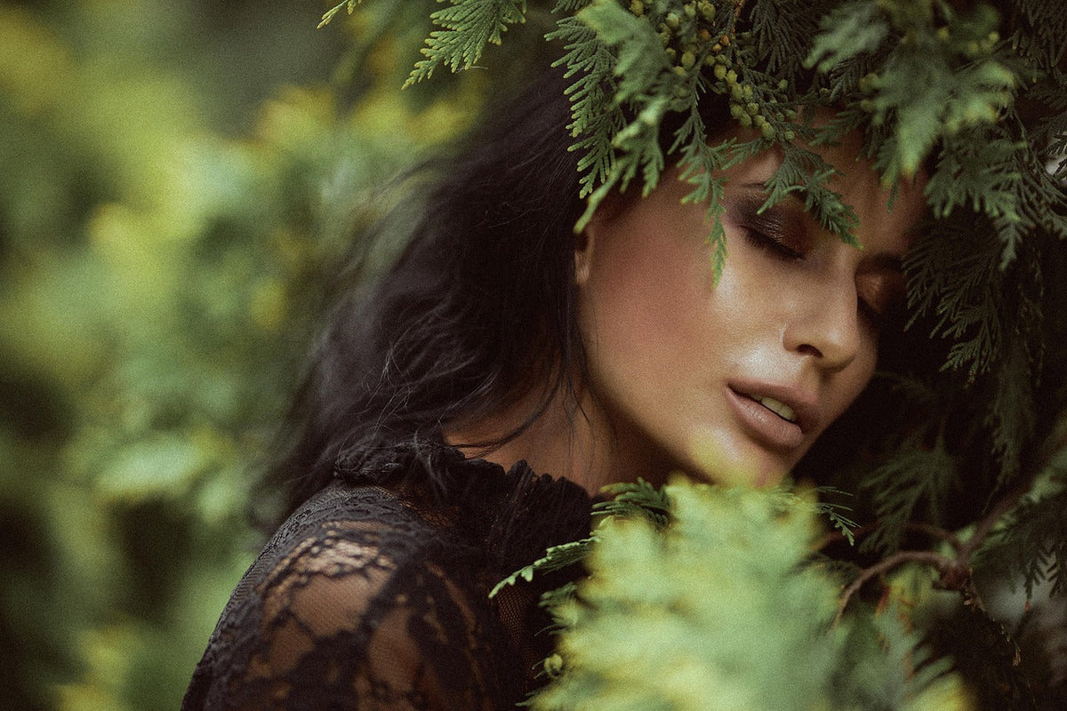 Beautiful woman with dark hair in a forrest